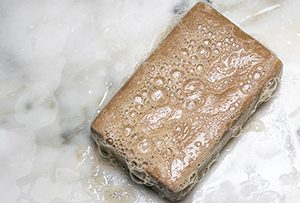 Can skin soap damage natural stone?